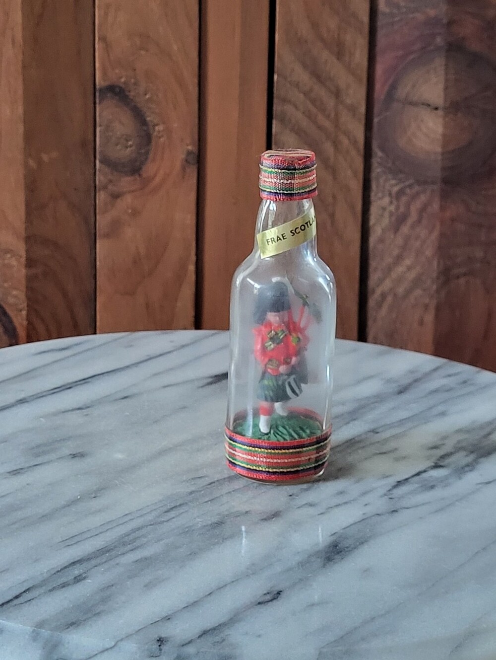 Festive Red Scottish Doll in Decorative Bottle